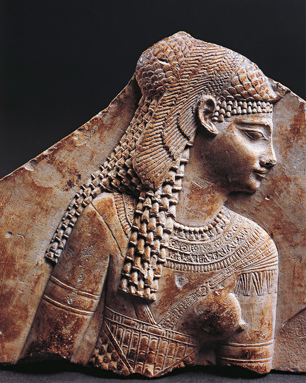 An ancient Egyptian carving of a person.