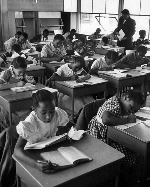 Students do schoolwork in a classroom