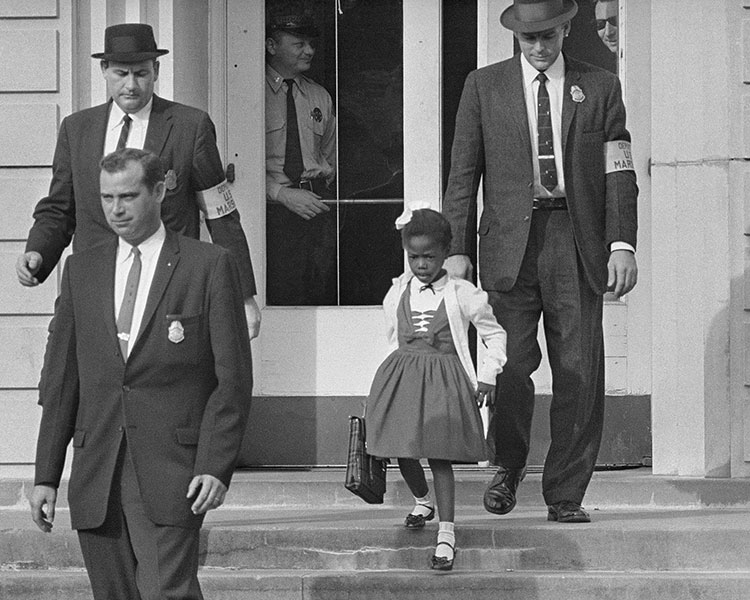 Federal Agents escort a young girl at school