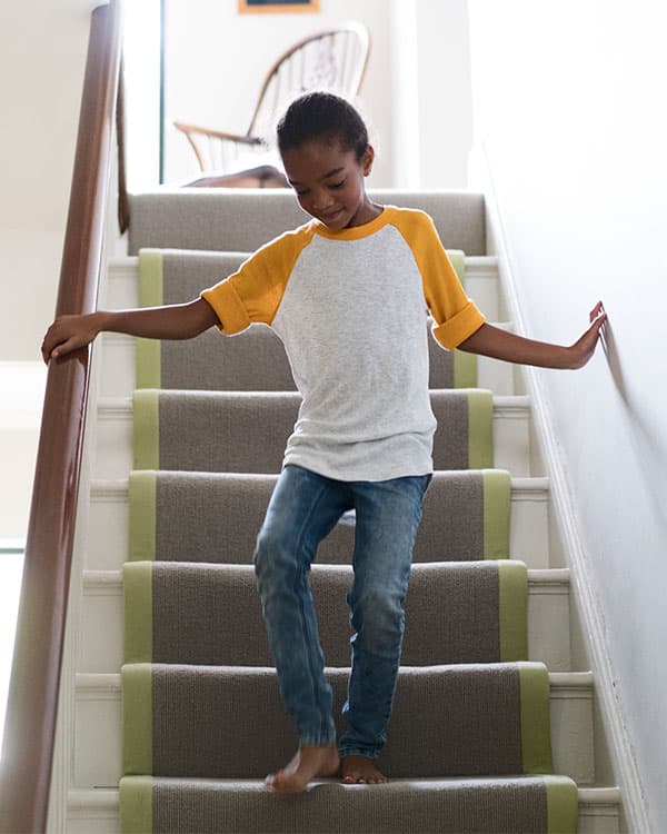 Kid walking down the stairs