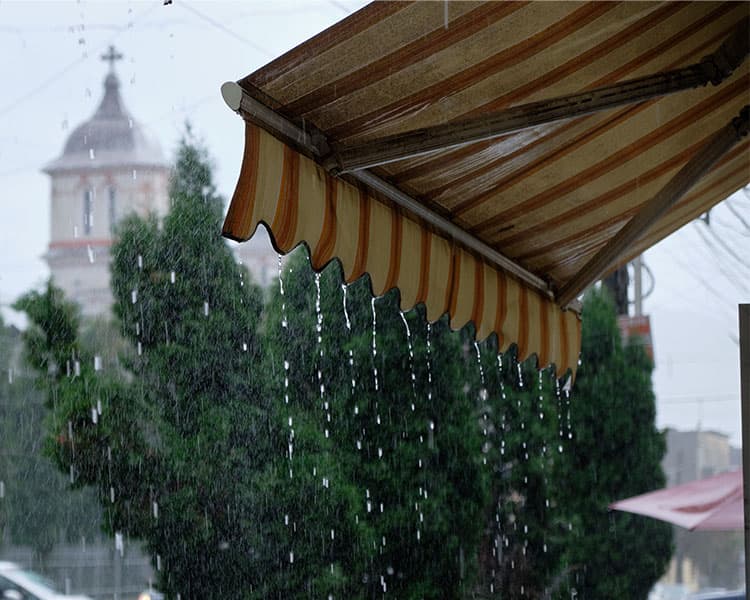 An awning with rain dripping off it