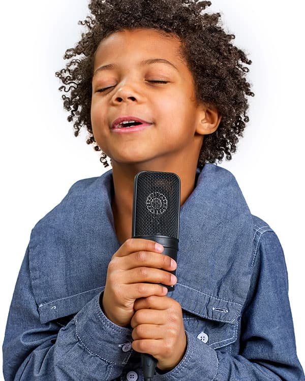 Kid singing into a microphone