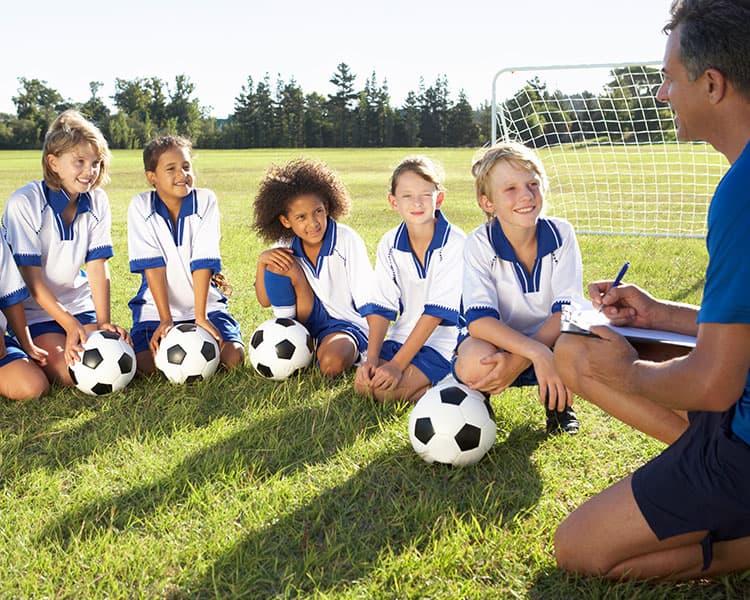 Soccer players with their coach