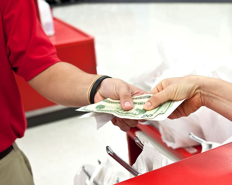 Two people exchange money