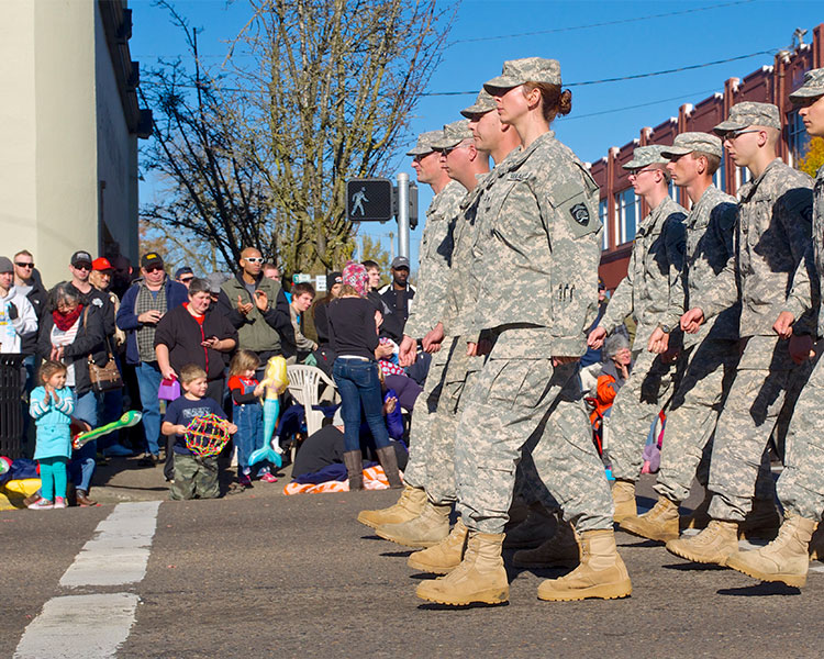 Soldiers march in the street.