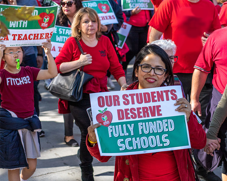 Group of teachers protesting for fully funded schools