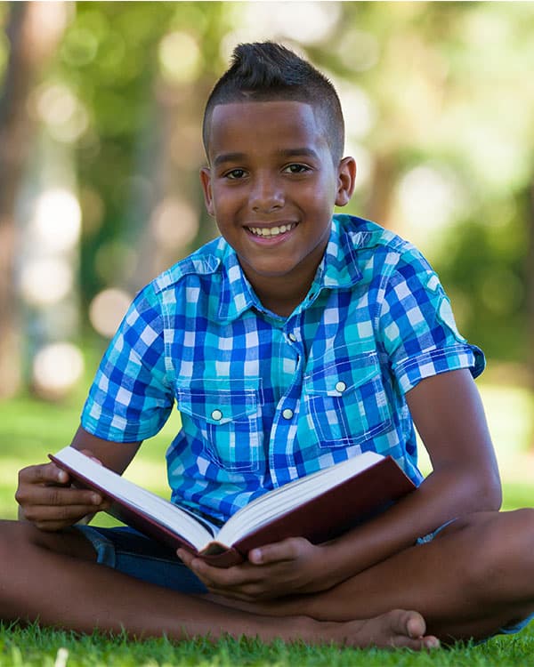 A boy reading a book.