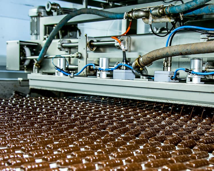 A machine making candy bars.