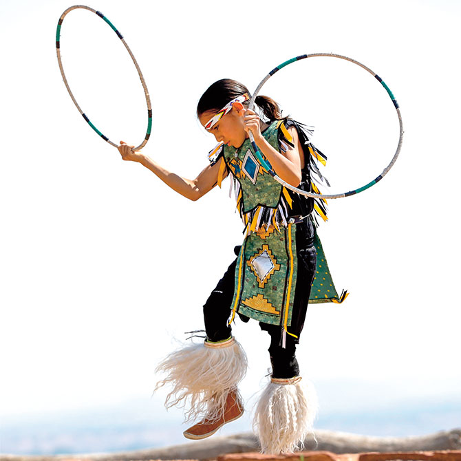 Enlargeable photo of a hoop dancer wearing traditional native dancing clothes
