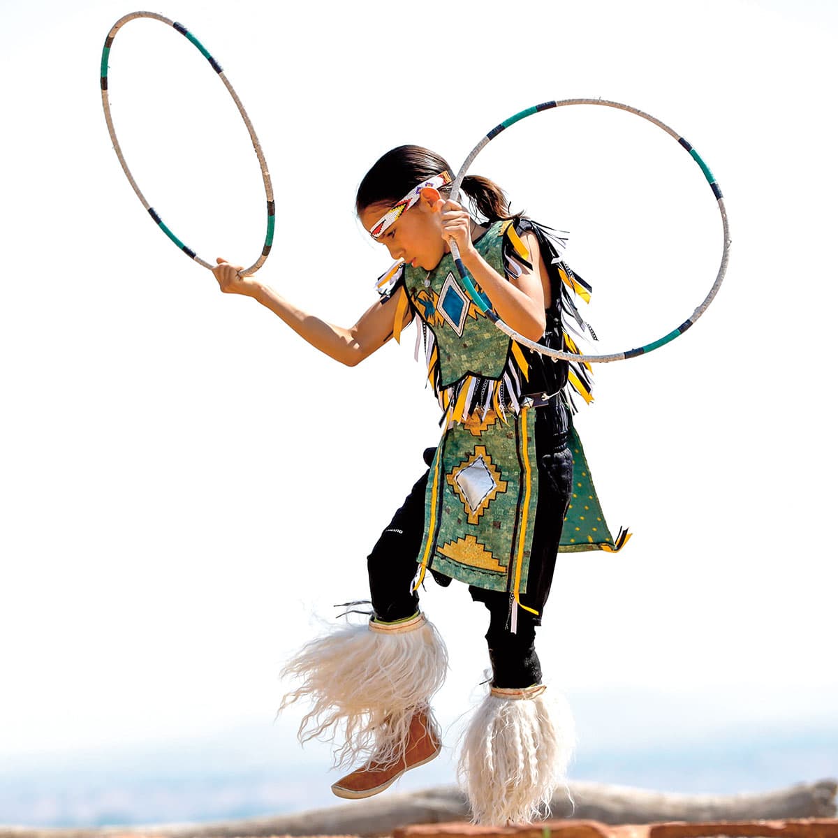 Hoop dancer wearing traditional native dancing clothes