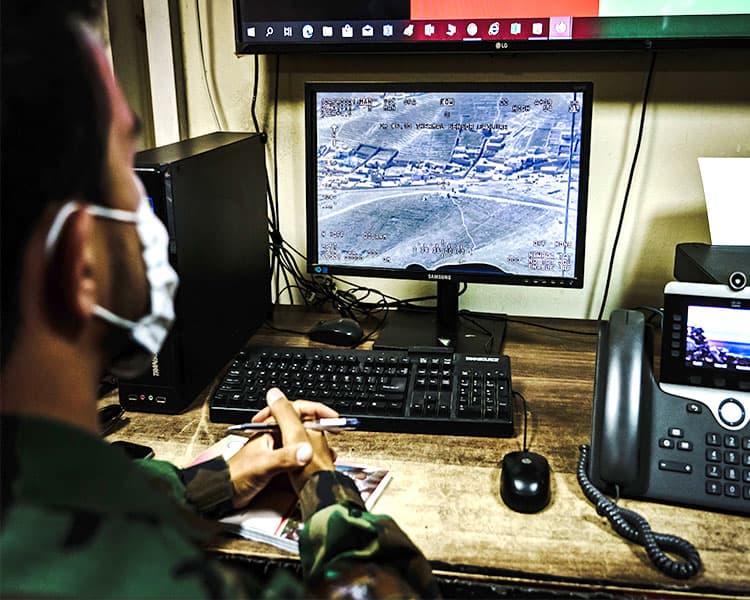 Military official checking satellite images