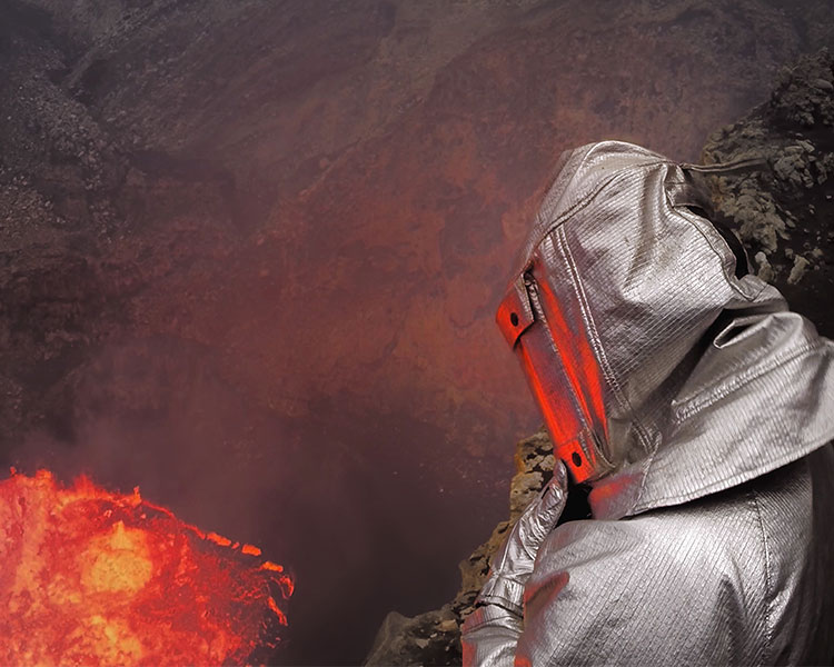 Image of a person who studies volcanoes wearing a special protection suit