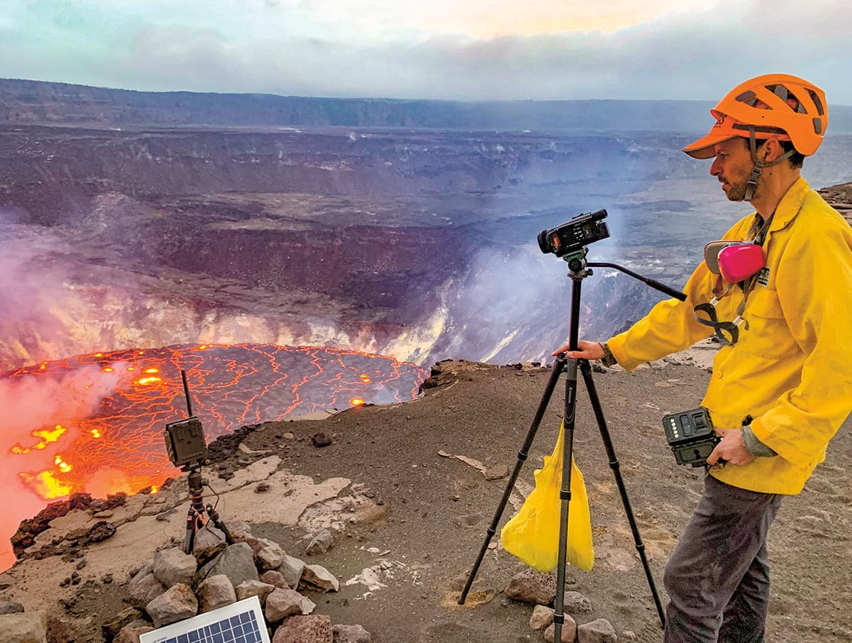 Photo of a scientist monitoring a volcano