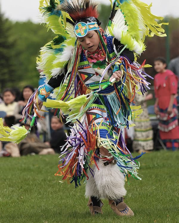 Kid dressed in colorful traditional cultural clothing