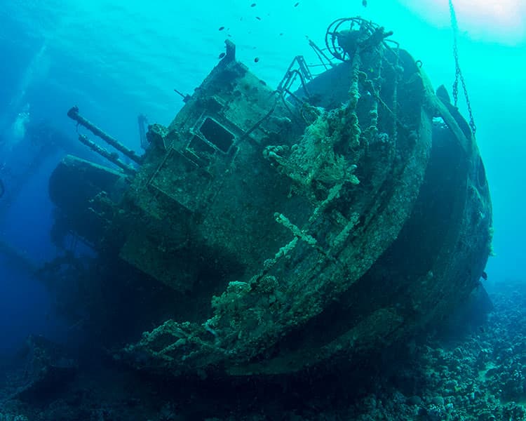 Image of a corroding ship wreckage underwater