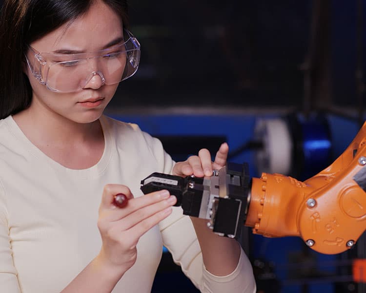Image of a person creating a prototype with machinery
