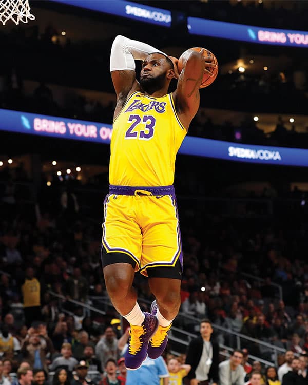 Photo of LeBron James in his Laker uniform going up for a slam dunk