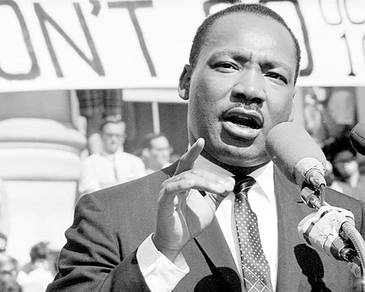 Black & white photo of MLK Jr. giving a speech