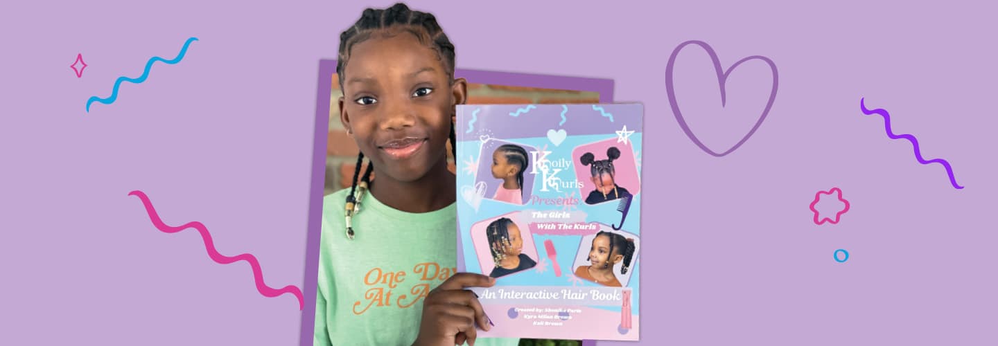 Photo of a kid holding her book about different hairstyles