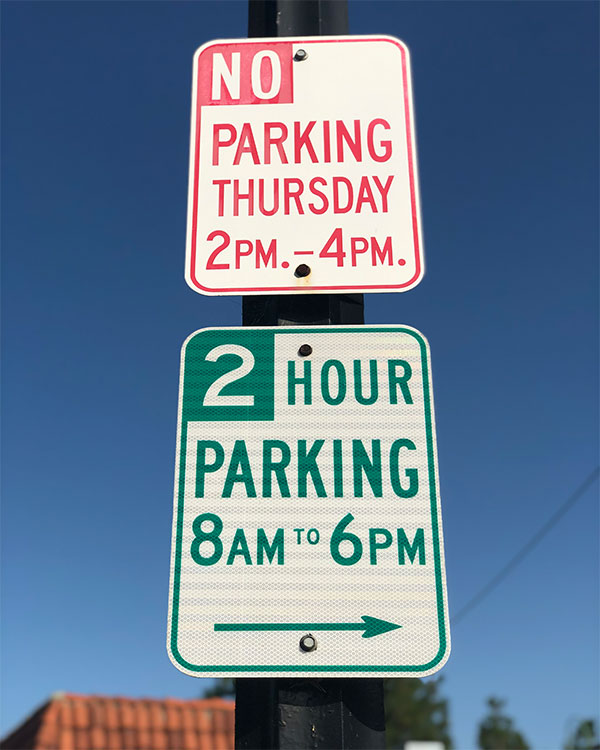 Image of two parking signs