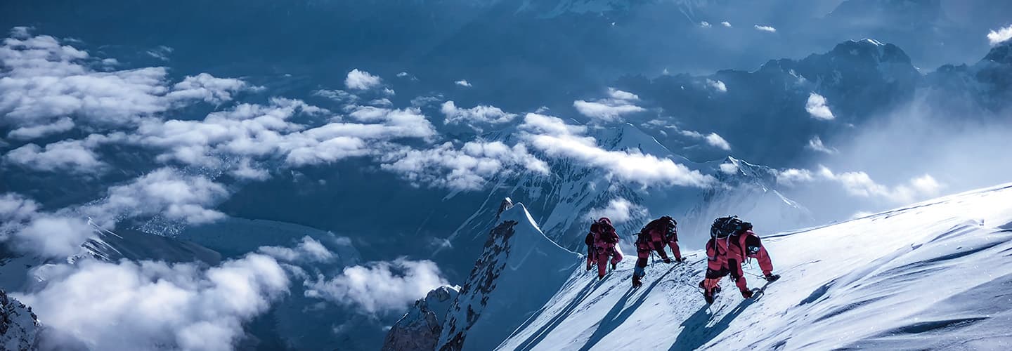 Image of people climbing high up Mt. Everest