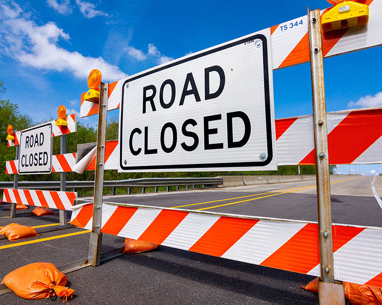 Image of a "Road Closed" signs